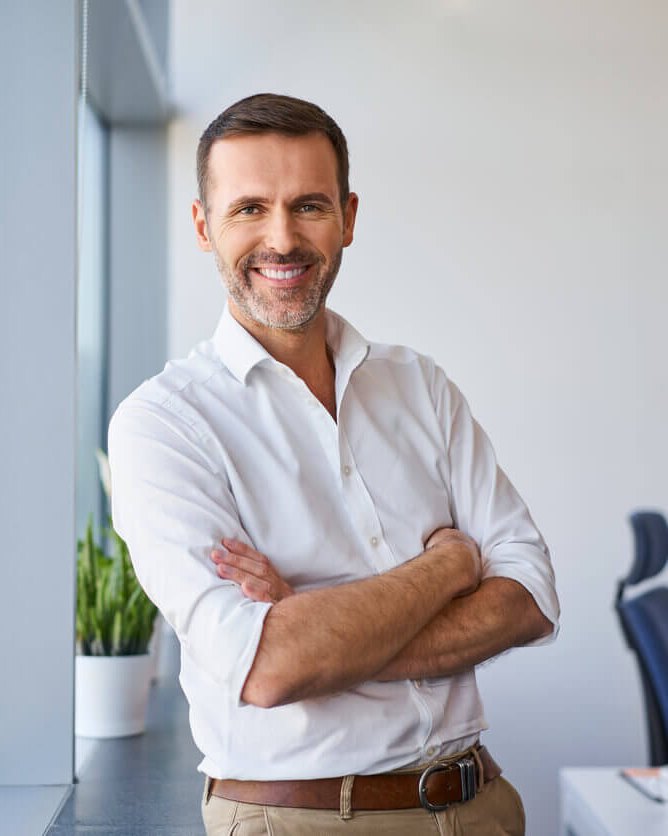 A Brisbane business owner in their office after switching accountants to LINK Advisors